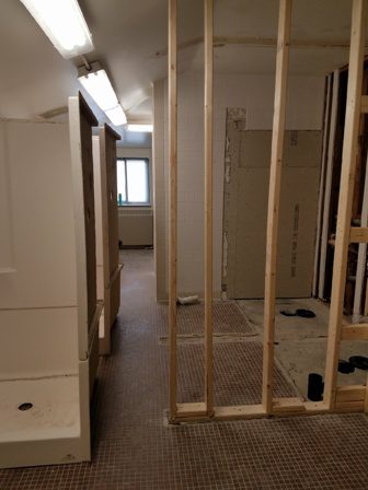 A bathroom that is being remodeled with wood framing.