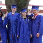 A group of graduates posing for a picture.