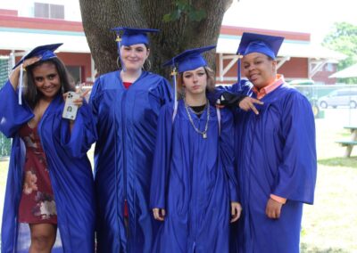 A group of graduates posing for a picture.