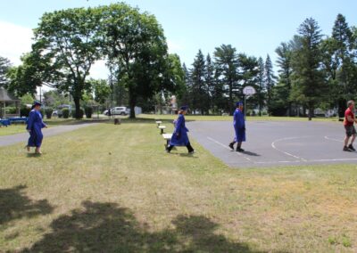 A group of people playing basketball in a park.