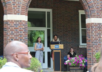 A group of people standing at a podium.