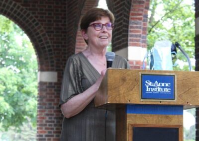 A woman standing at a podium.