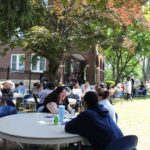 A group of people sitting at a table.