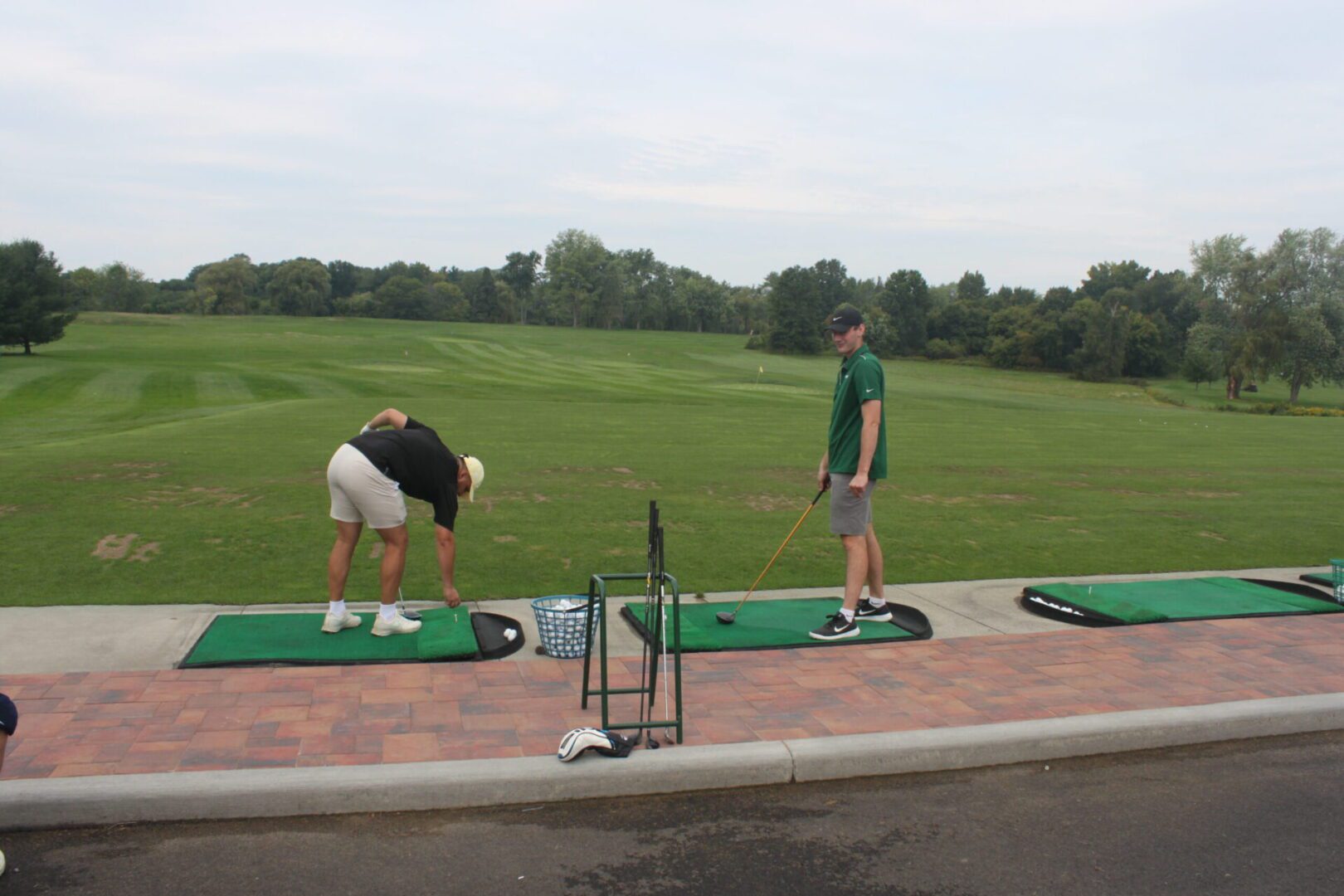 A group of people on a golf course.