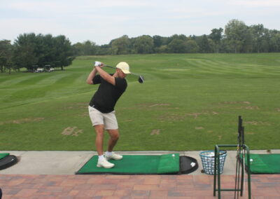 A man swinging a golf club.