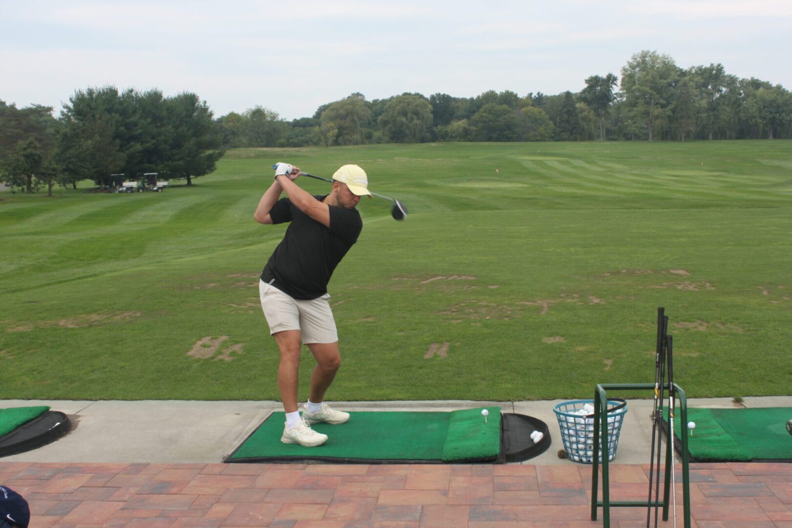 A man swinging a golf club.