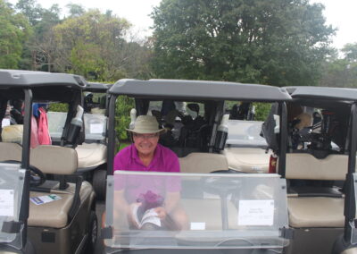 A man sitting in a golf cart.