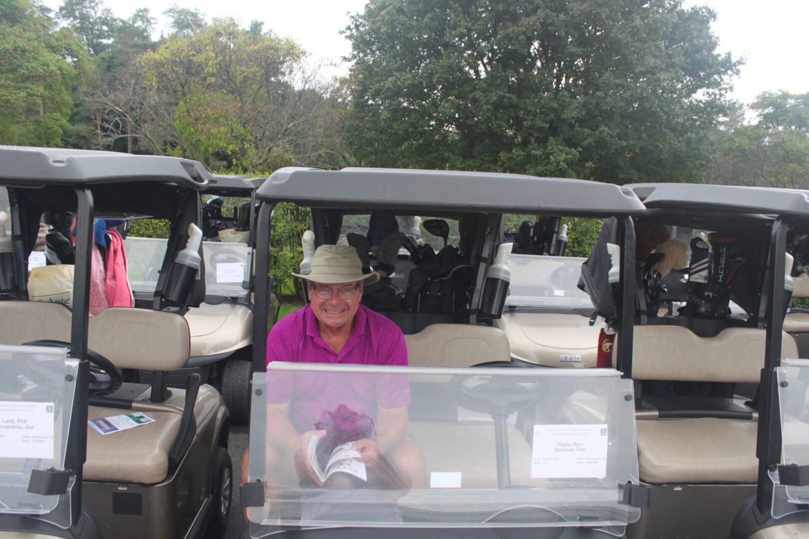 A man sitting in a golf cart.