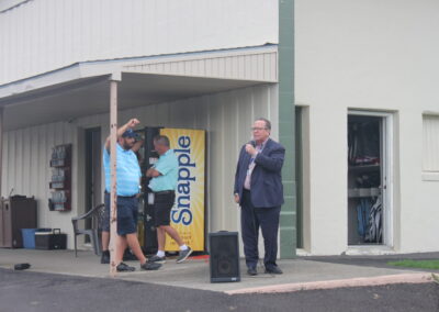 A man is standing in front of a building.