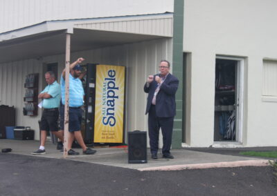 A man standing in front of a building.