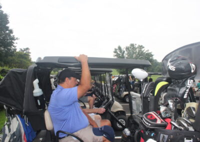 A man in a golf cart.