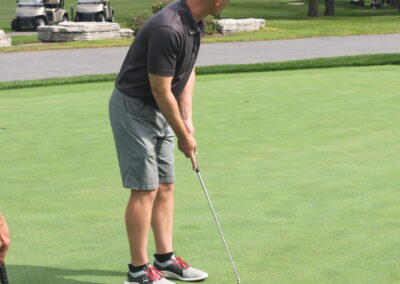 Two men on a golf course.