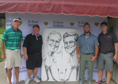 A group of men posing for a photo with a caricature.