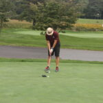 A man on a golf course.