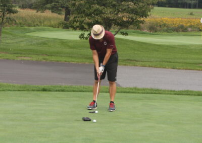 A man on a golf course.