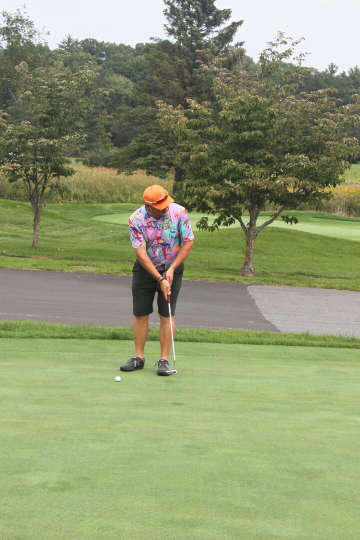 A man on a golf course.