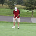 A man on a golf course.