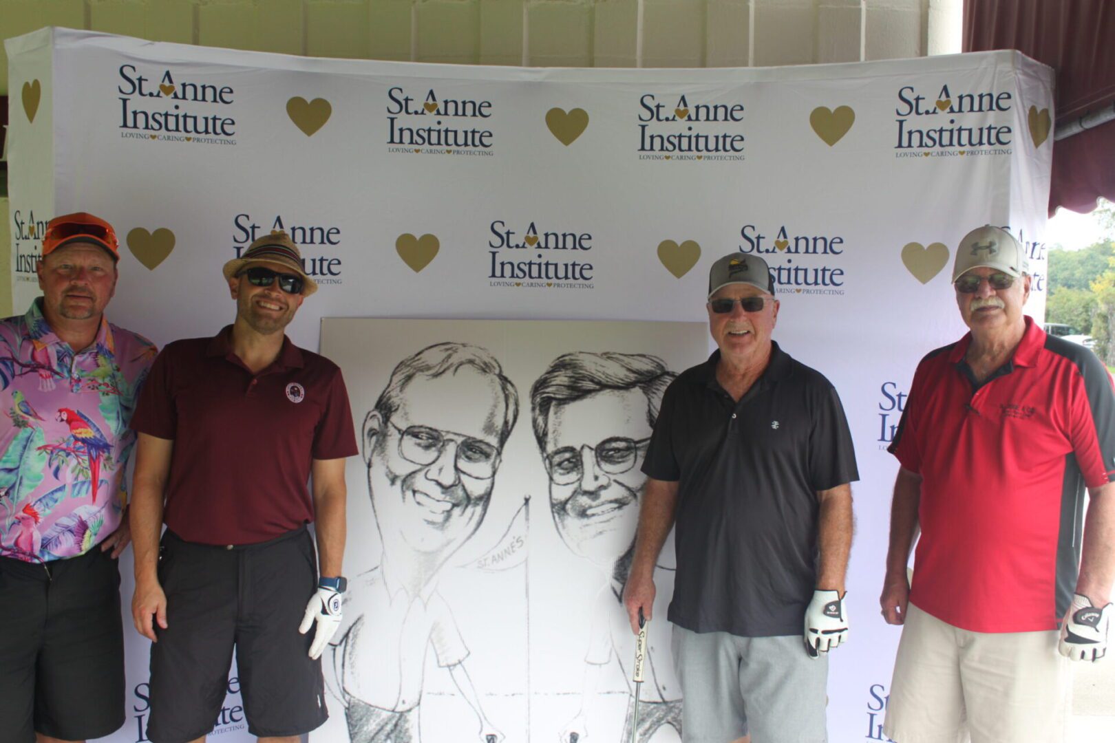 A group of men posing in front of a caricature.