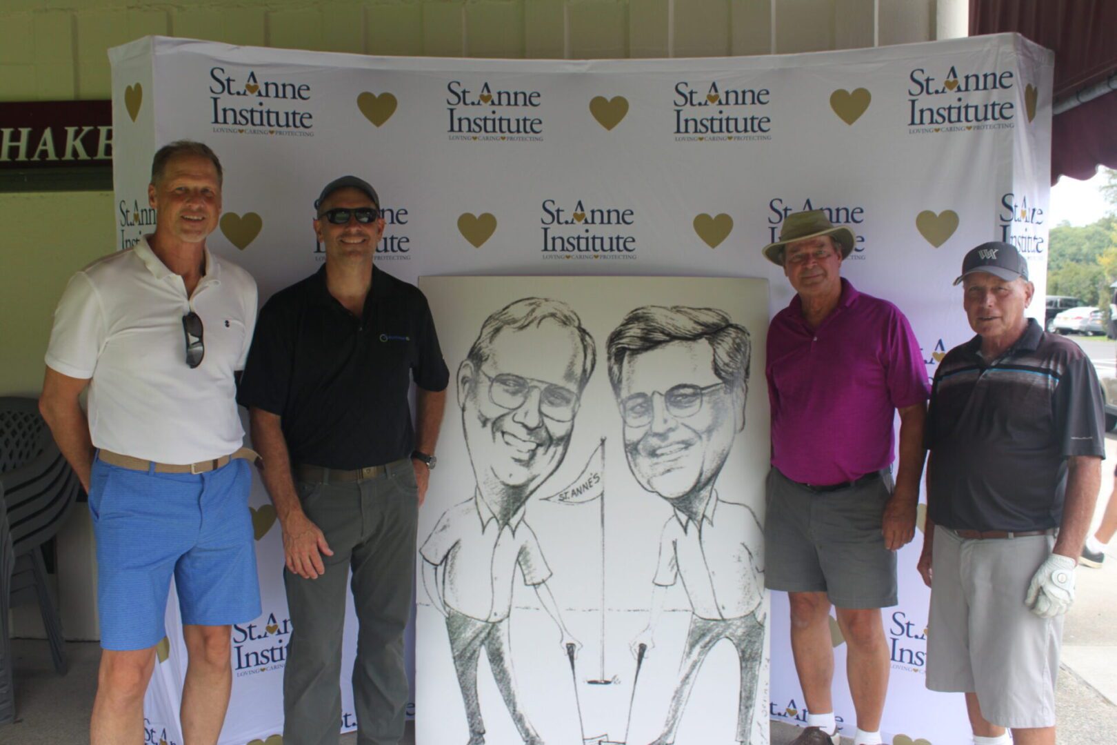A group of men posing for a photo with a caricature.
