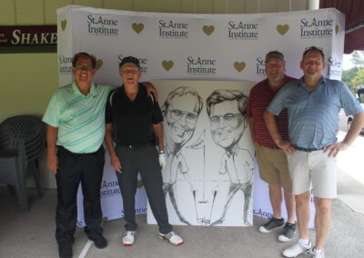 A group of men posing for a photo with a caricature.