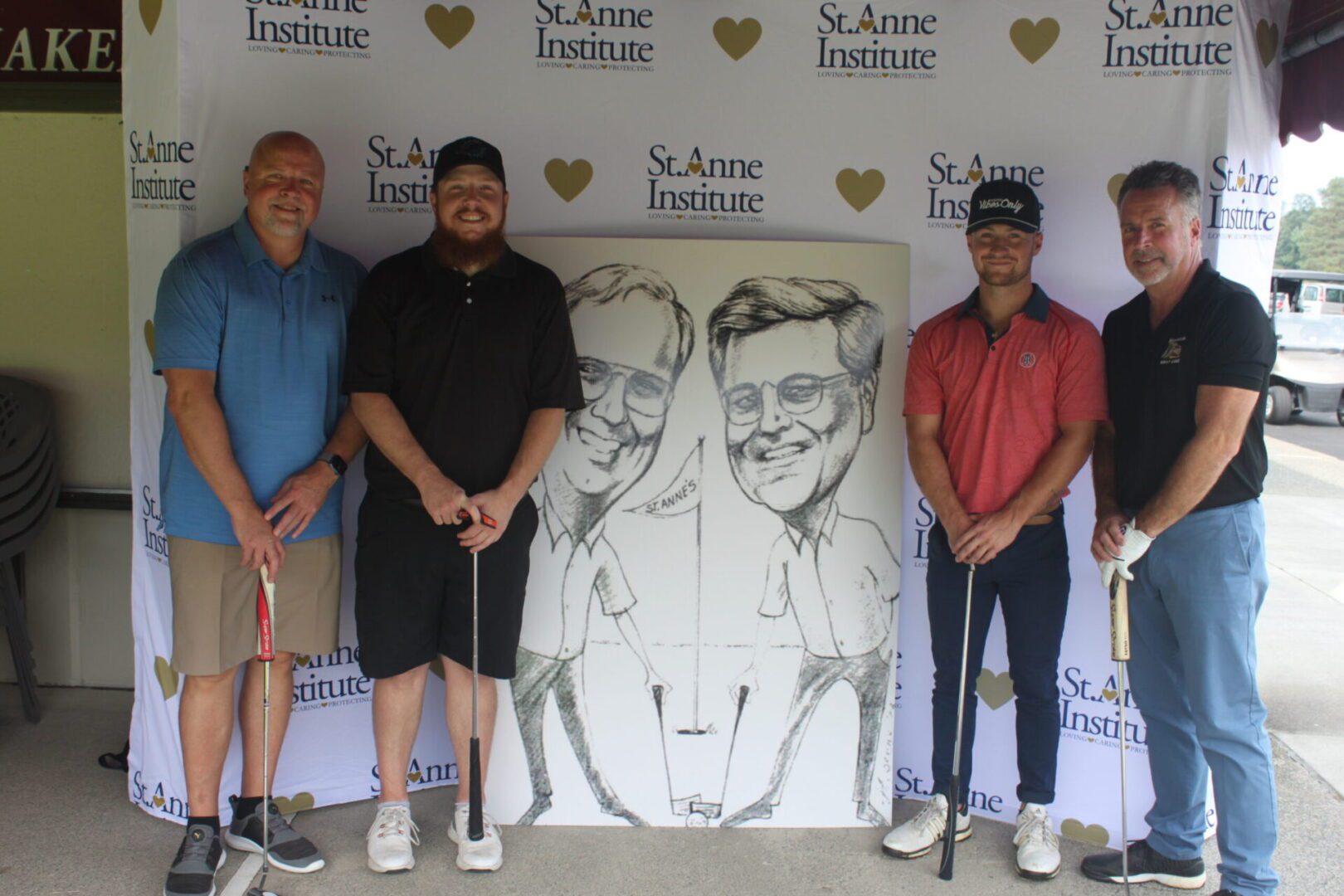A group of men posing for a photo with a caricature.