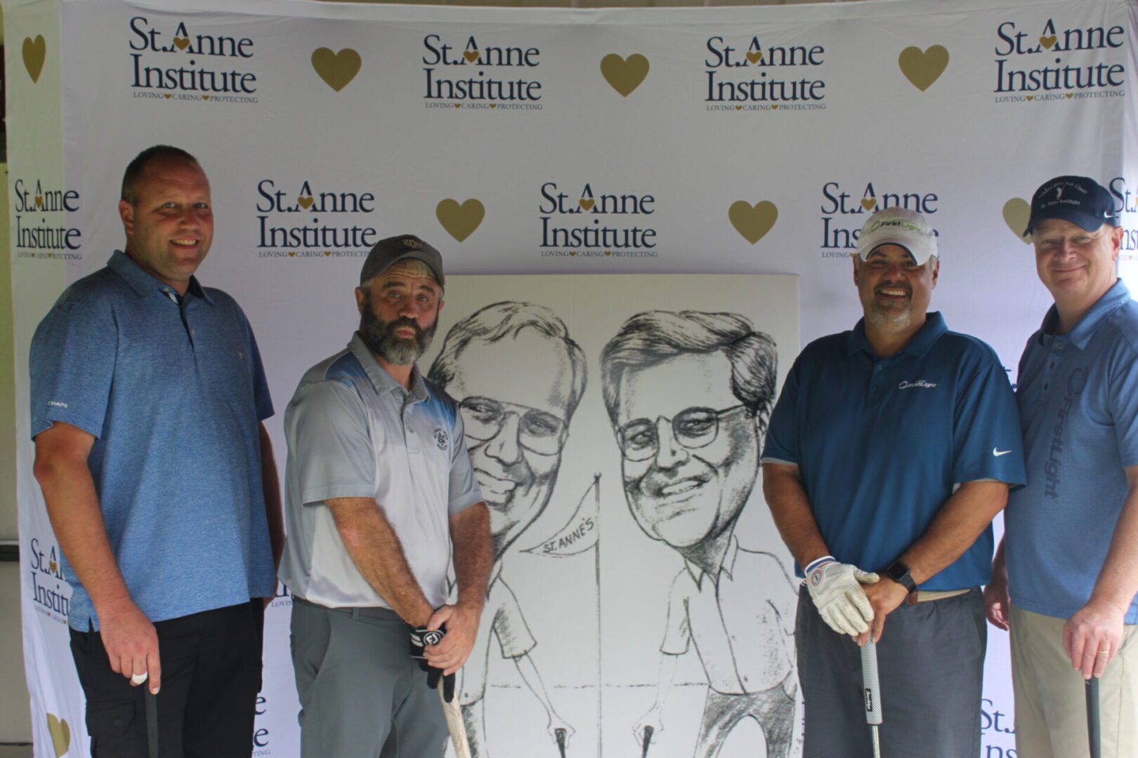 A group of men posing for a photo with a caricature.