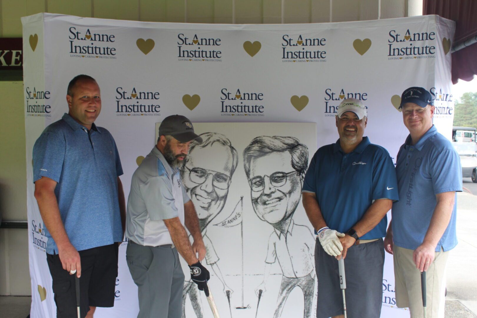 A group of men posing for a photo with a caricature.