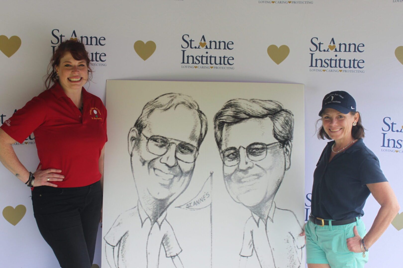 Two women standing next to a caricature of two men.