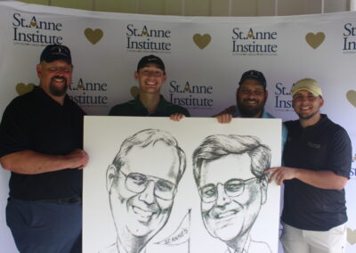 A group of men holding up a caricature.