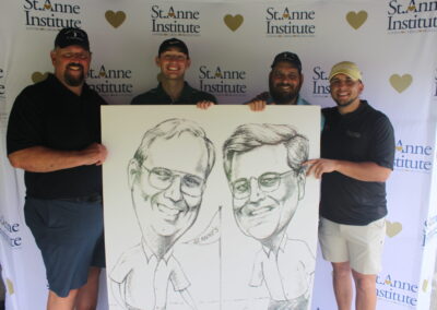 A group of men holding up a caricature.