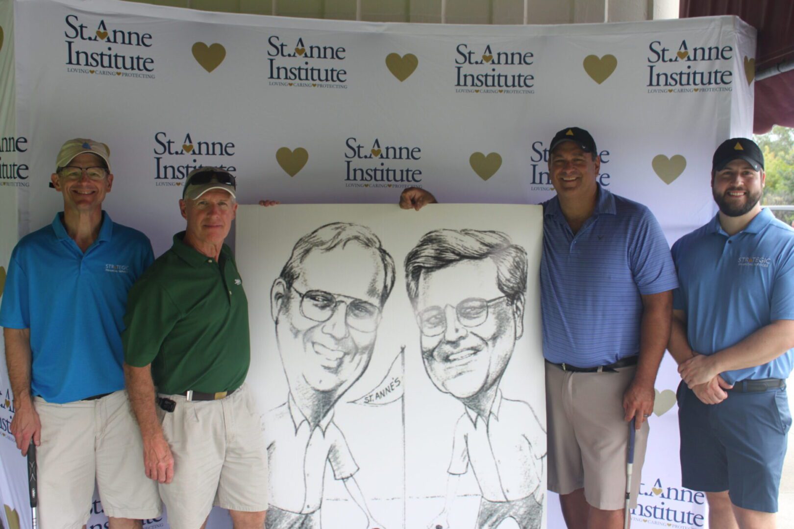 A group of men posing for a photo with a caricature.