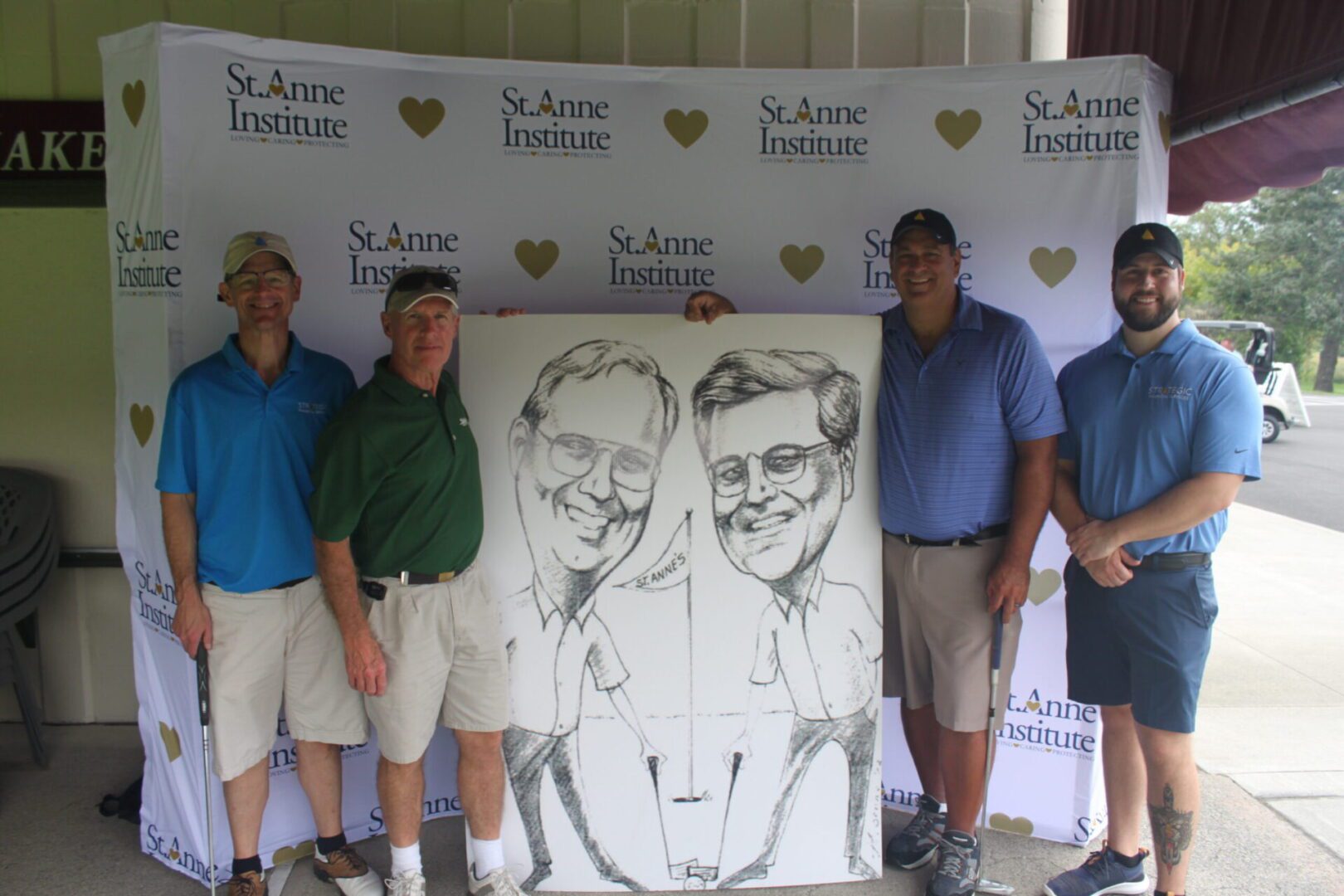 A group of men posing with a caricature.