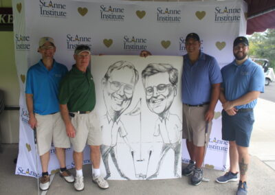 A group of men posing with a caricature.