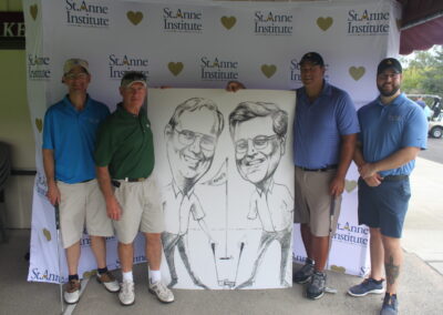 A group of men posing with a caricature.