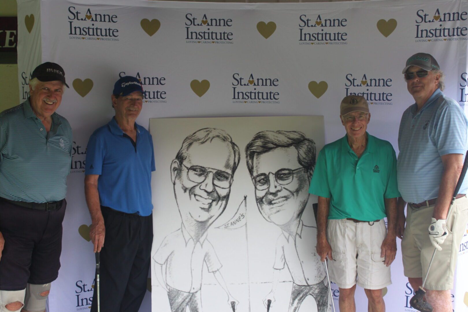 A group of men posing for a photo with a caricature.