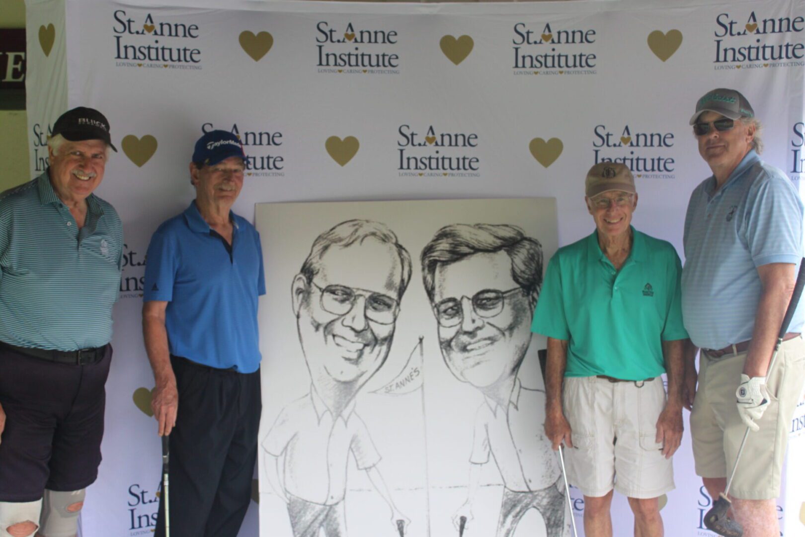 Two men standing next to a large drawing of men.