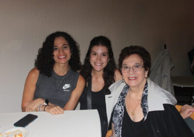 Three women posing for a picture.