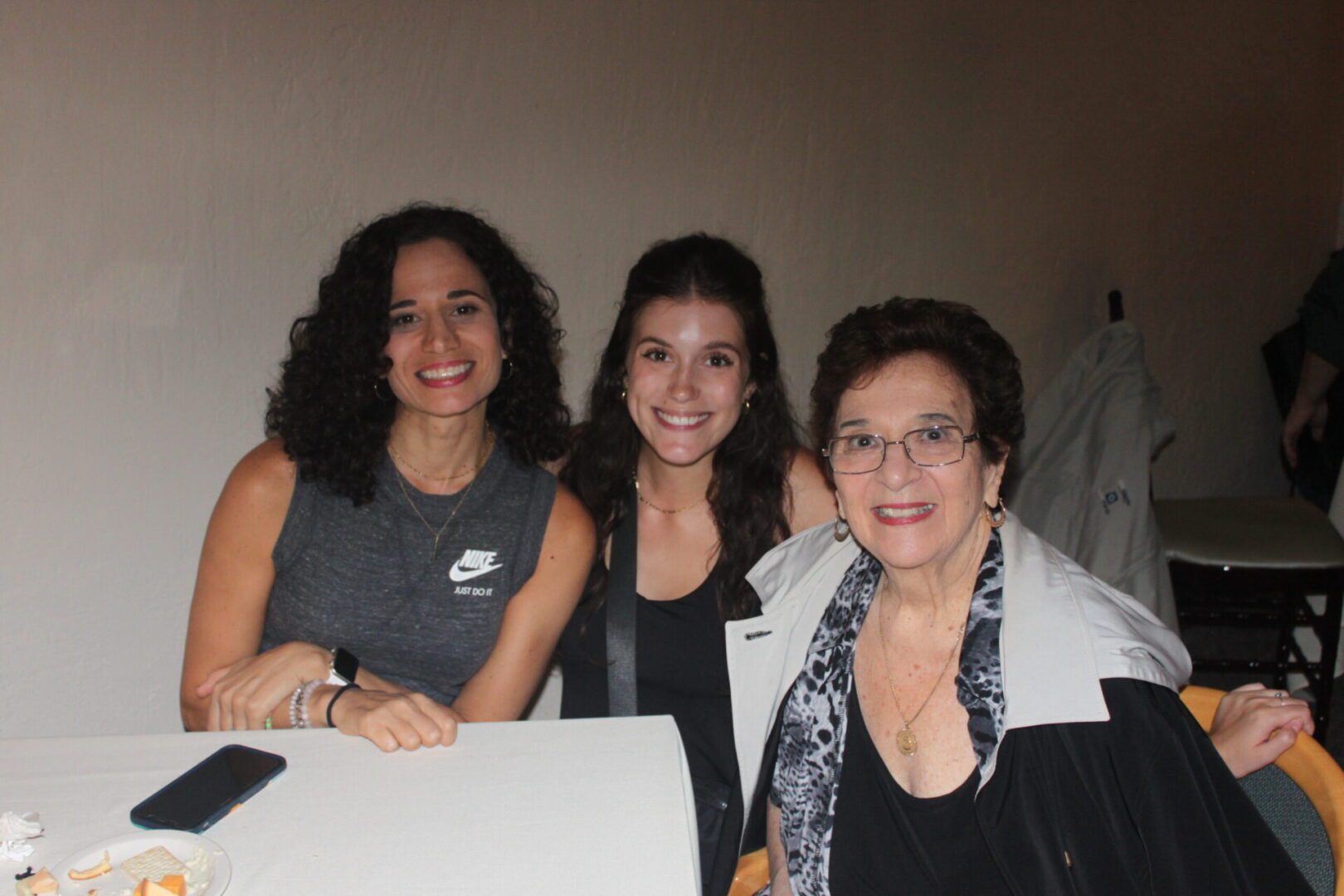 Three women posing for a picture.