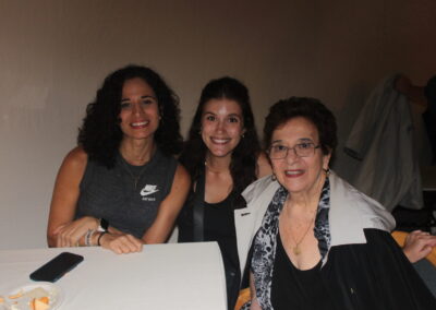 Three women posing for a picture.