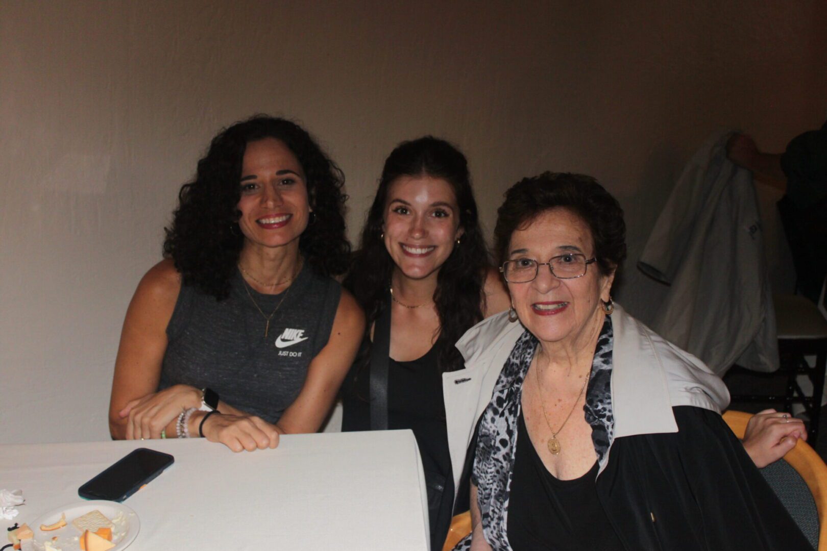 Three women posing for a picture.