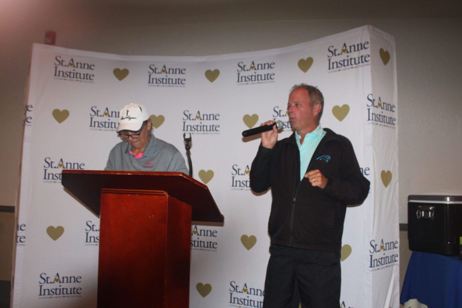 A man is speaking into a microphone.