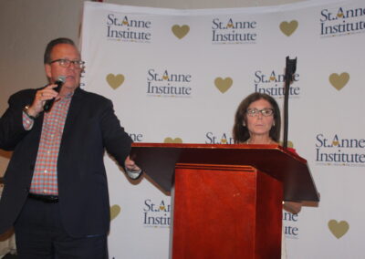 A man and a woman standing at a podium.