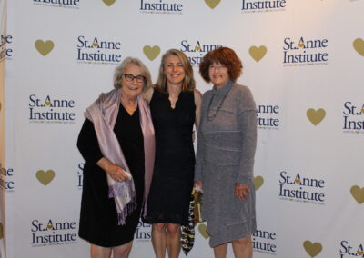 Three women posing for a photo.