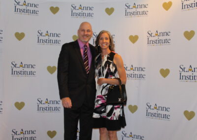 A man and woman posing for a picture.