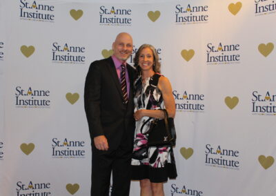 A man and woman posing for a picture.