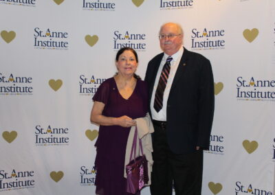 A man and woman posing for a picture.