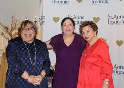 Three women posing for a photo.