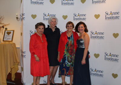 Four women posing for a picture.