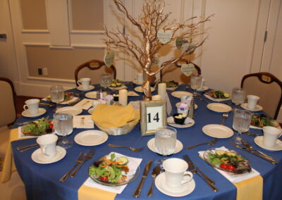 A table full of dishes and a tree design