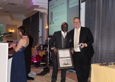 A man holding a plaque.